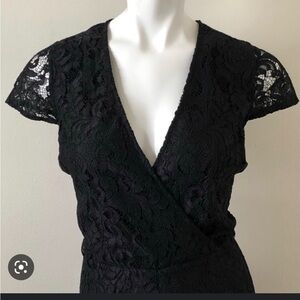 Black lace short sleeved romper size 10 New York & Company lined faux wrap